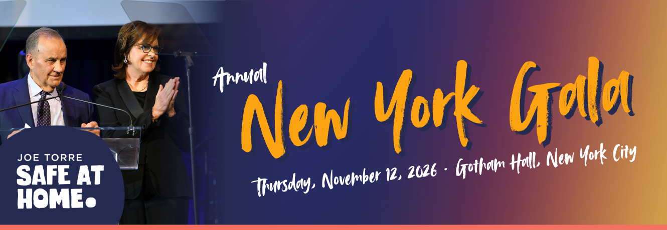 Two speakers at a podium during a gala, with a circular sign that says 'Joe Torre Safe At Home' on the left and bold 'Annual New York Gala' branding across a blue-to-orange gradient backdrop.